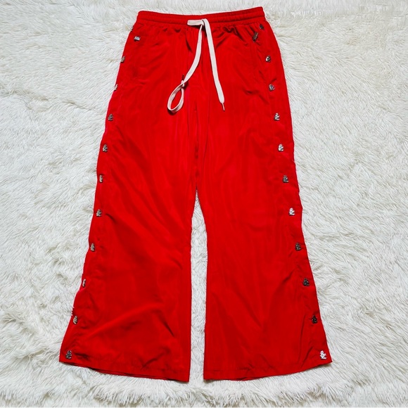 Hellstar nylon flare pants snap button sides
